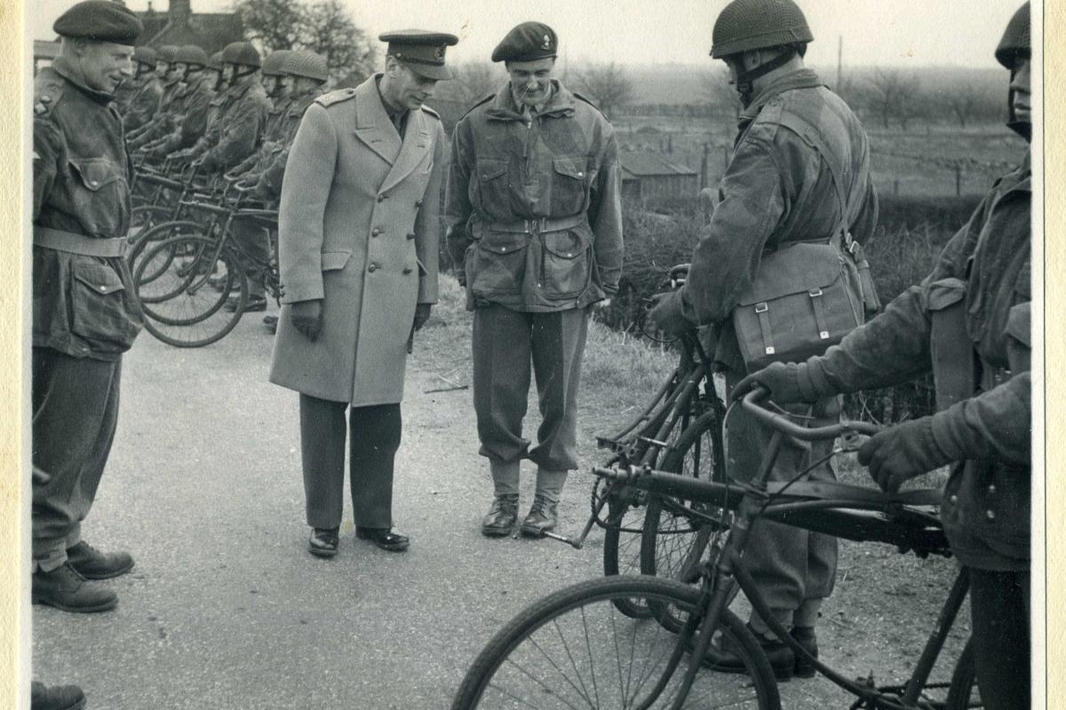 The King is shown a folding Airborne bike