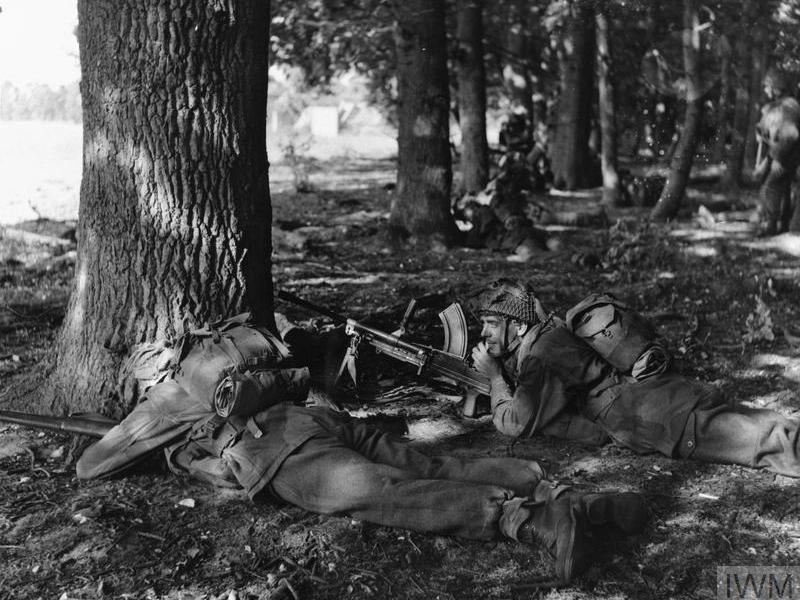 Paratroopers take cover in woodland