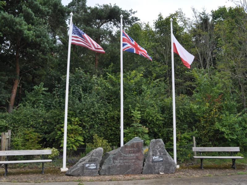 Flags of three nations fly over the memorial at Saltby airfield