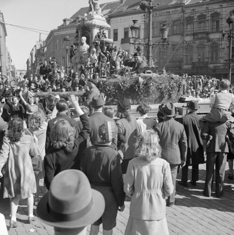 A British tank surrounded by joyous civilians in Brussels