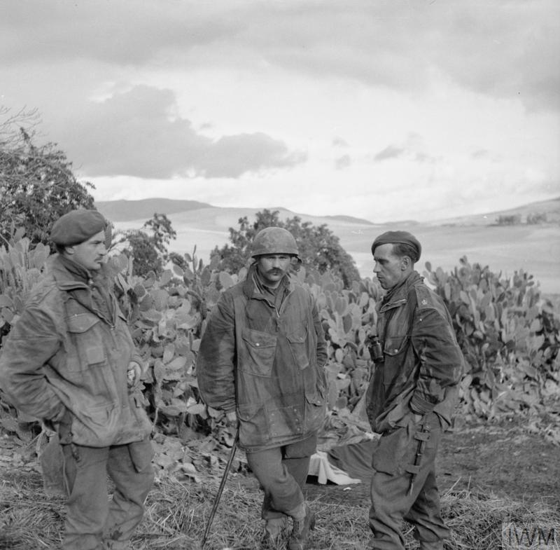 Three Parachute Regiment officers in conversation in North Africa