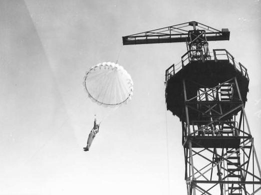 September 1941: a trainee Polish paratrooper descends from a parachute tower at Lundin Links, next to Lundin Tower in Fife