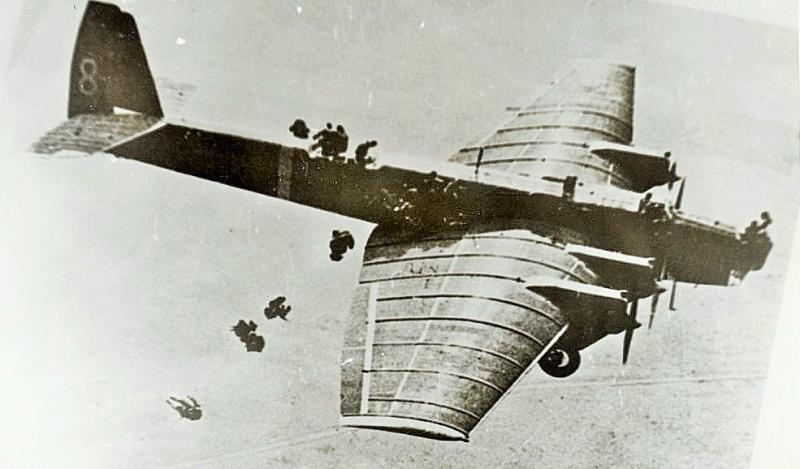 Soviet paratroopers jump from a Tupolev bomber in the 1930s