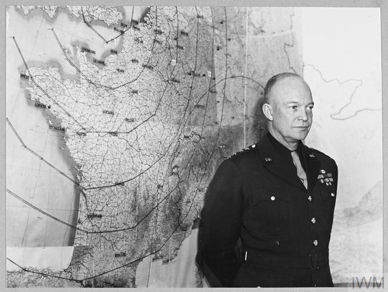 General Eisenhower in front of a map of France