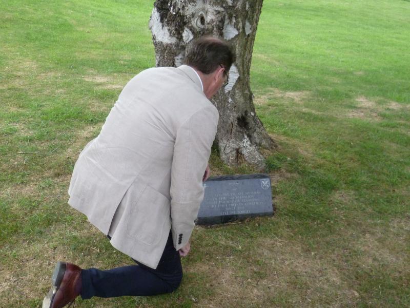 Lt Gen Harrison reads the inscription on a Stoke Rochford Hall memorial