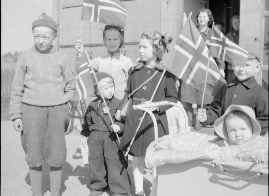 A group of Norwegian children who welcomed British troops after their arrival at Gardermoen airfield near Oslo
