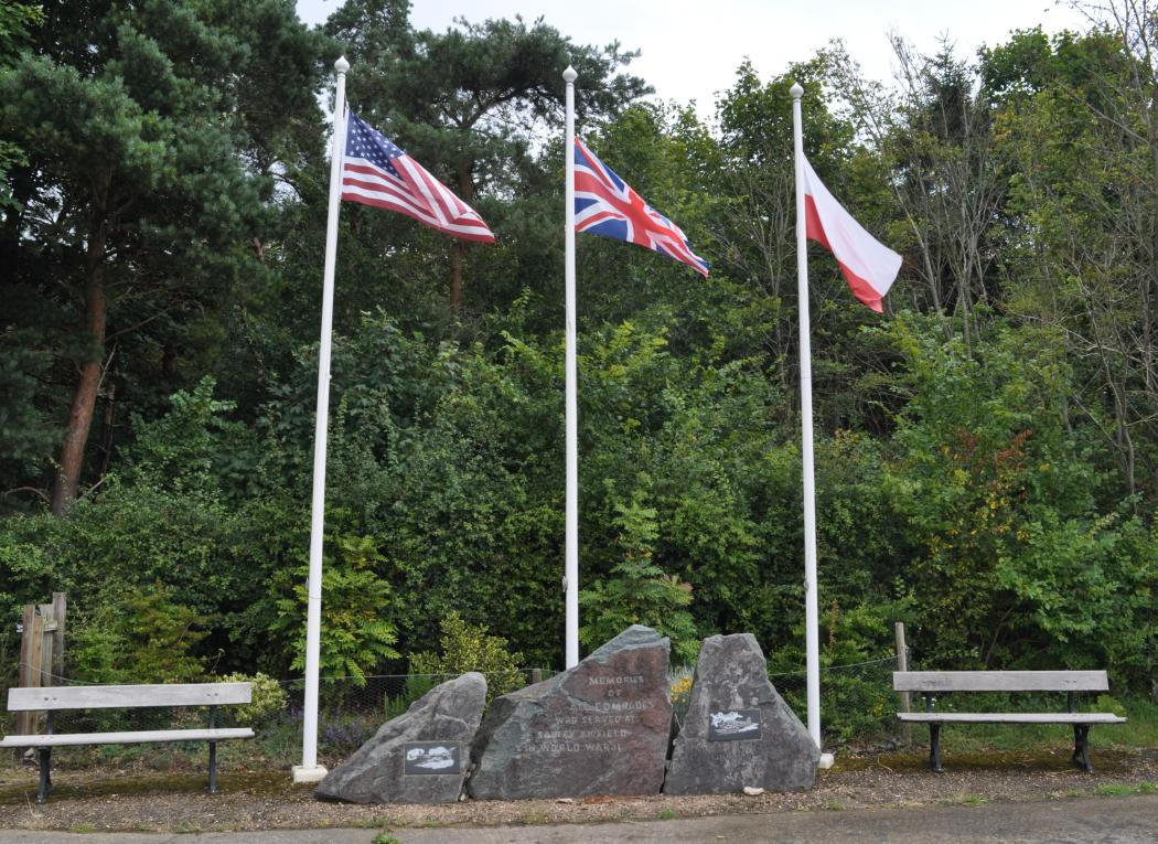 Flags of three nations fly over the memorial at Saltby airfield